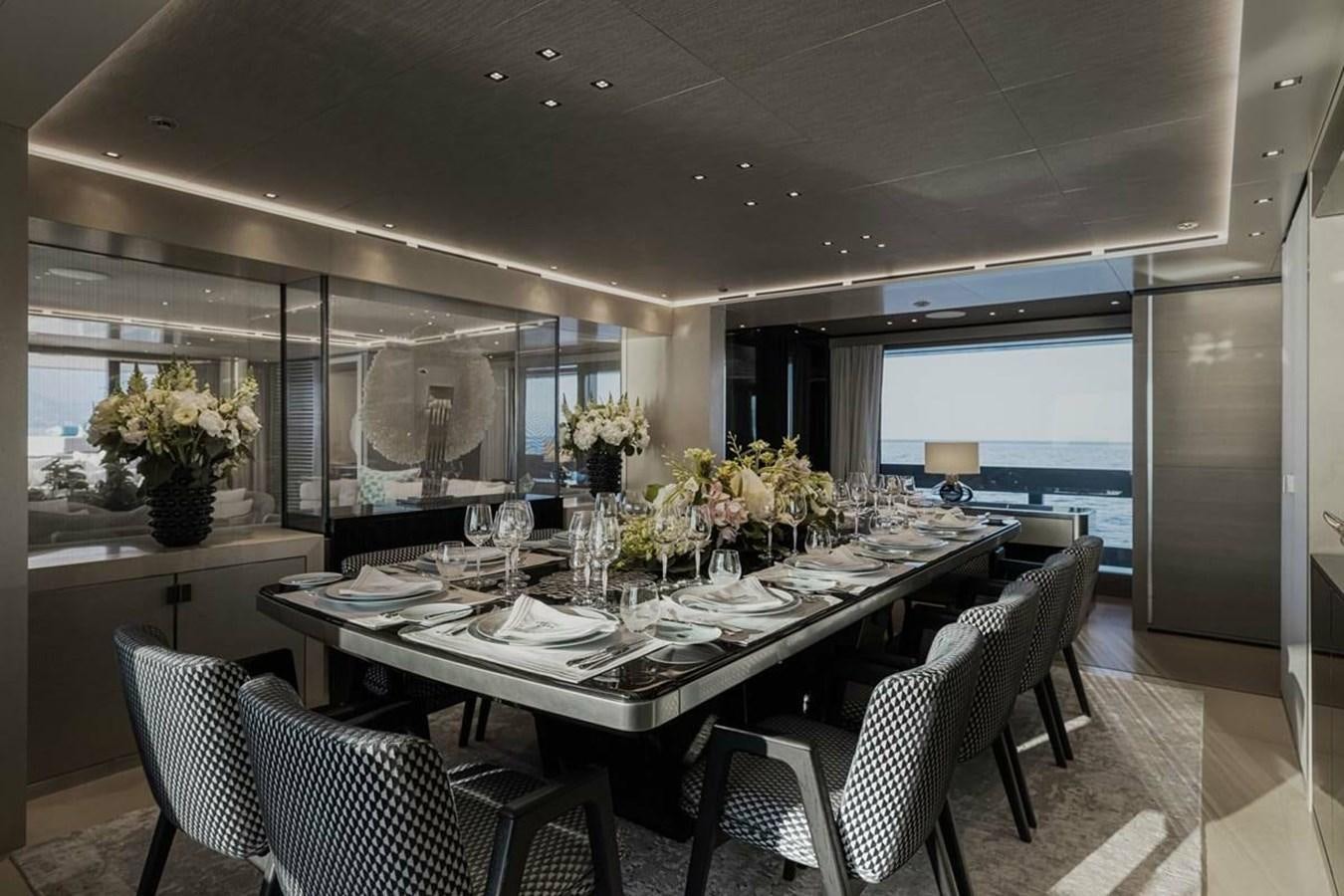 a dining room with a large table aboard LEMON TREE Yacht for Charter