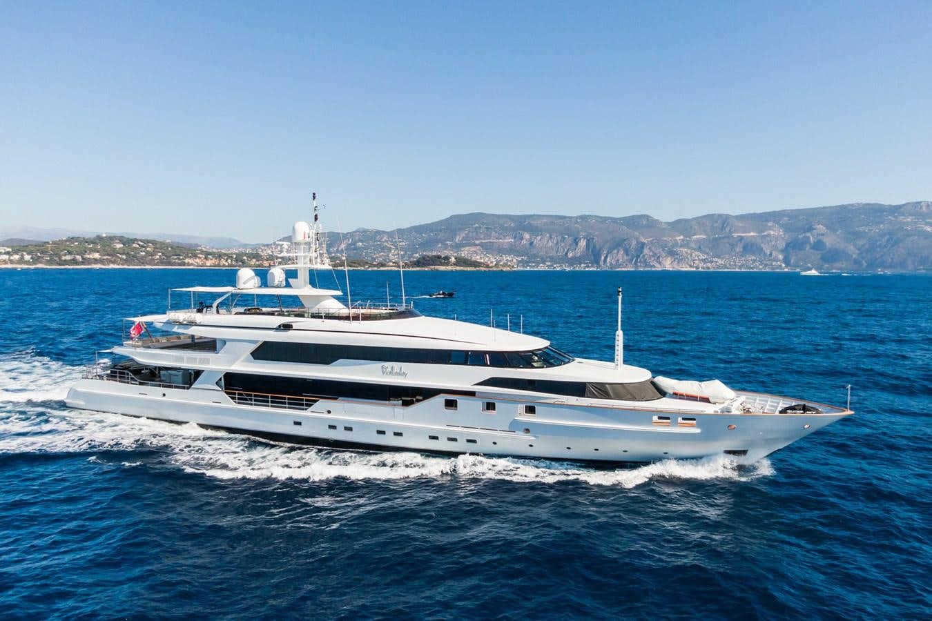 a white yacht in the water aboard THE WELLESLEY Yacht for Sale