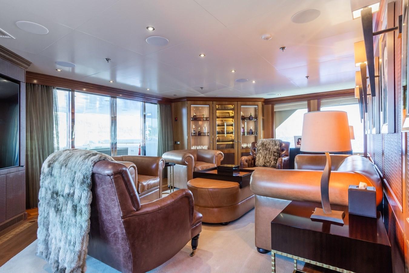 a living room with a large window aboard THE WELLESLEY Yacht for Sale