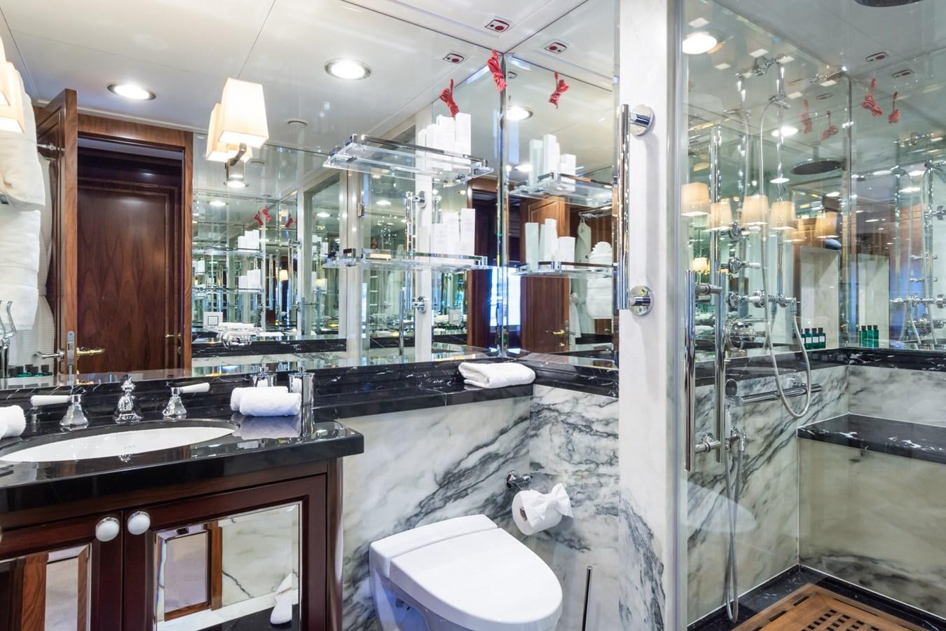 a bathroom with a large mirror aboard THE WELLESLEY Yacht for Sale
