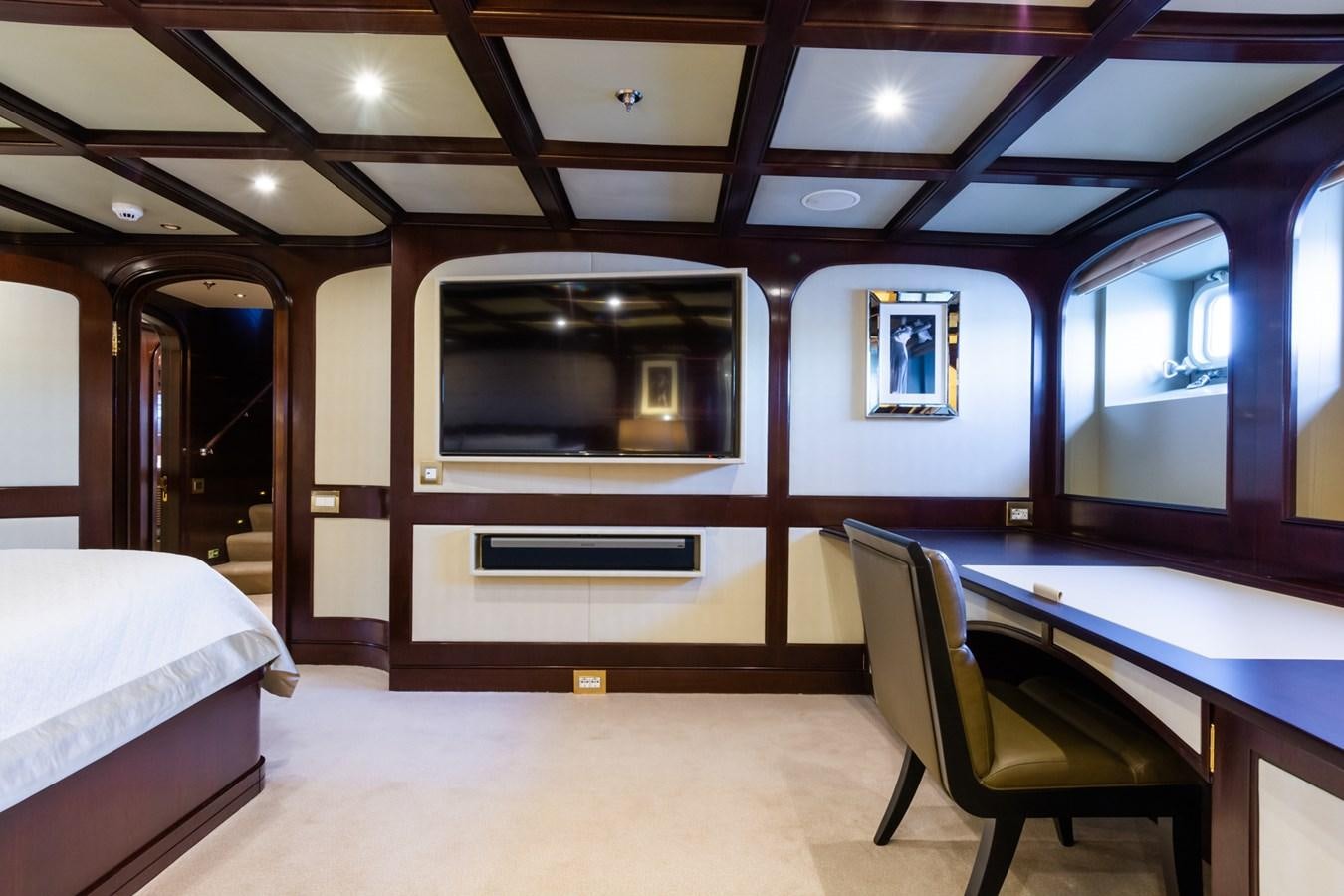 a room with a bed and a tv aboard THE WELLESLEY Yacht for Sale