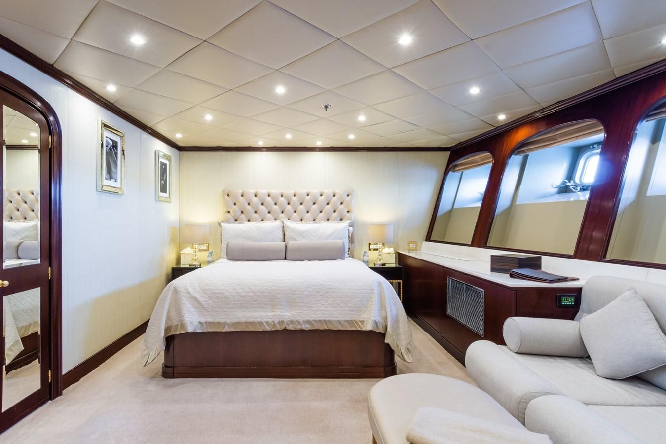 a room with a bed and a desk aboard THE WELLESLEY Yacht for Sale