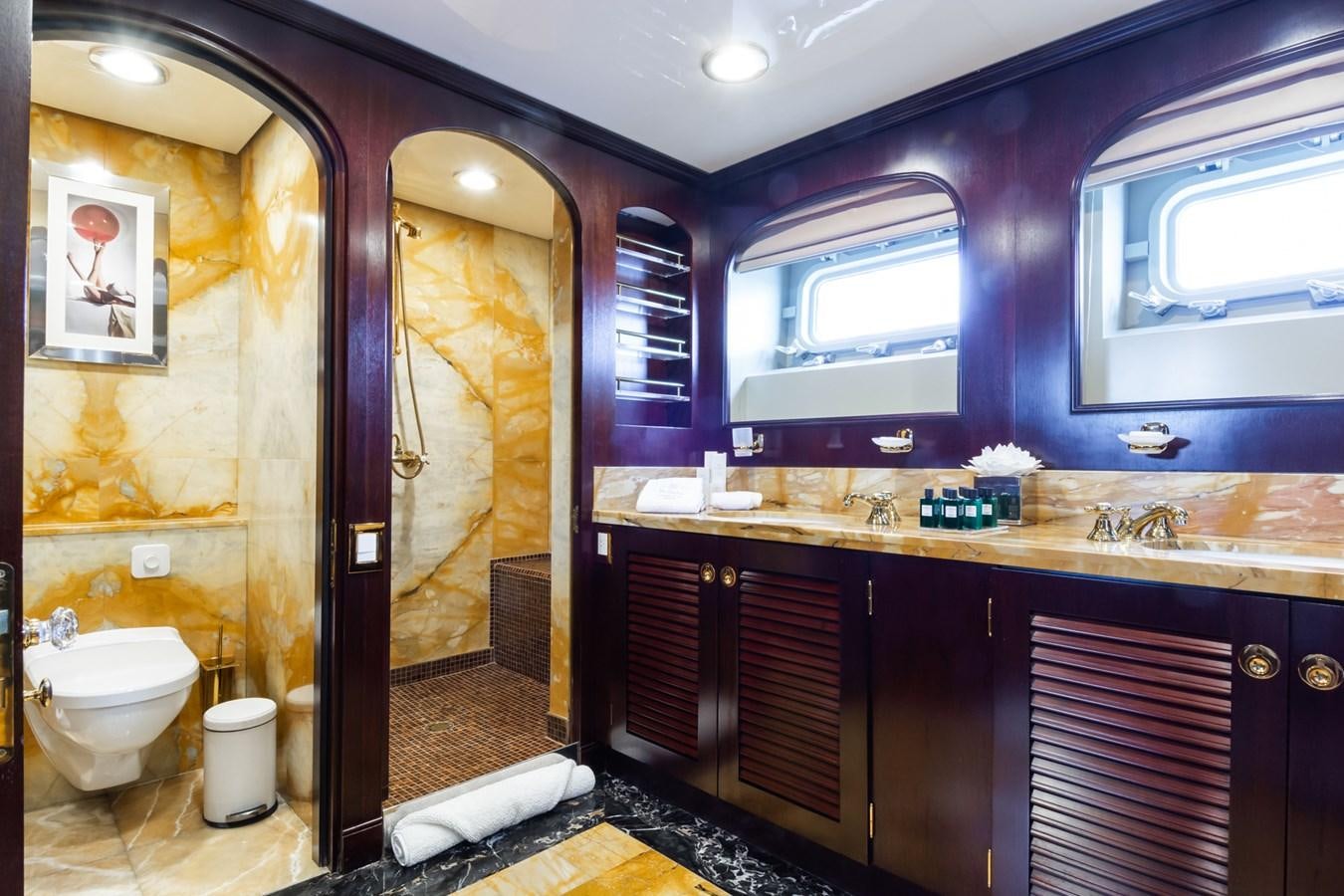 a bathroom with a large mirror aboard THE WELLESLEY Yacht for Sale