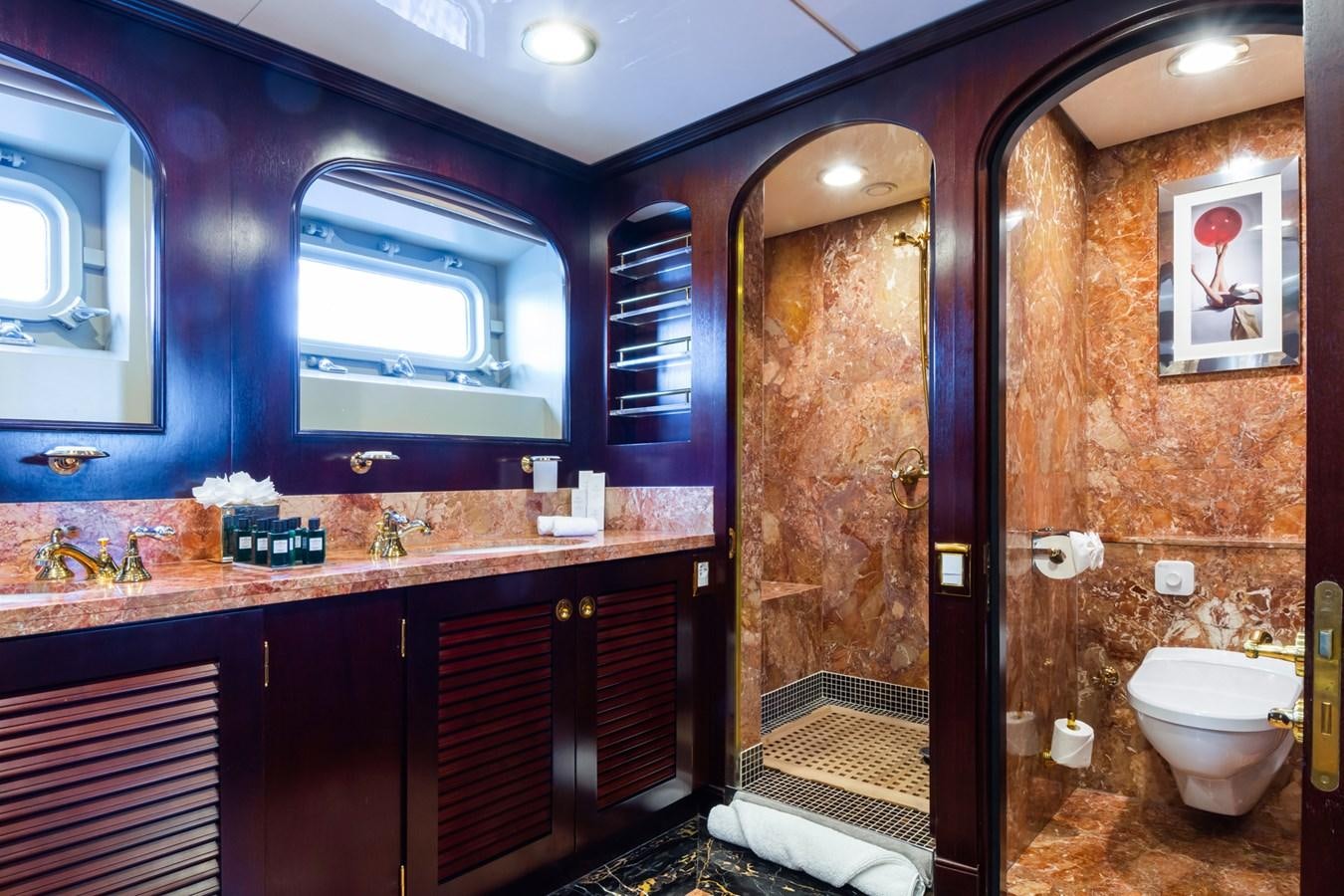 a bathroom with a glass shower aboard THE WELLESLEY Yacht for Sale