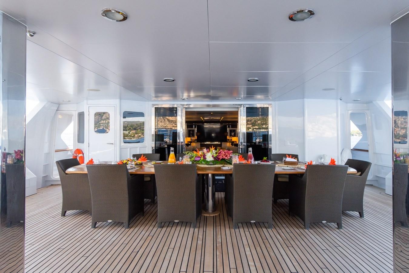 a large kitchen with a table and chairs aboard THE WELLESLEY Yacht for Sale