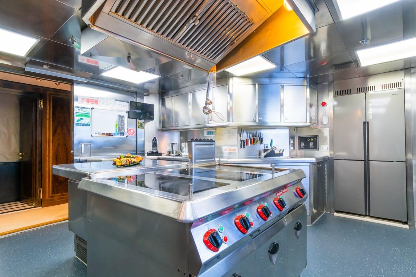 a kitchen with stainless steel appliances aboard THE WELLESLEY Yacht for Sale