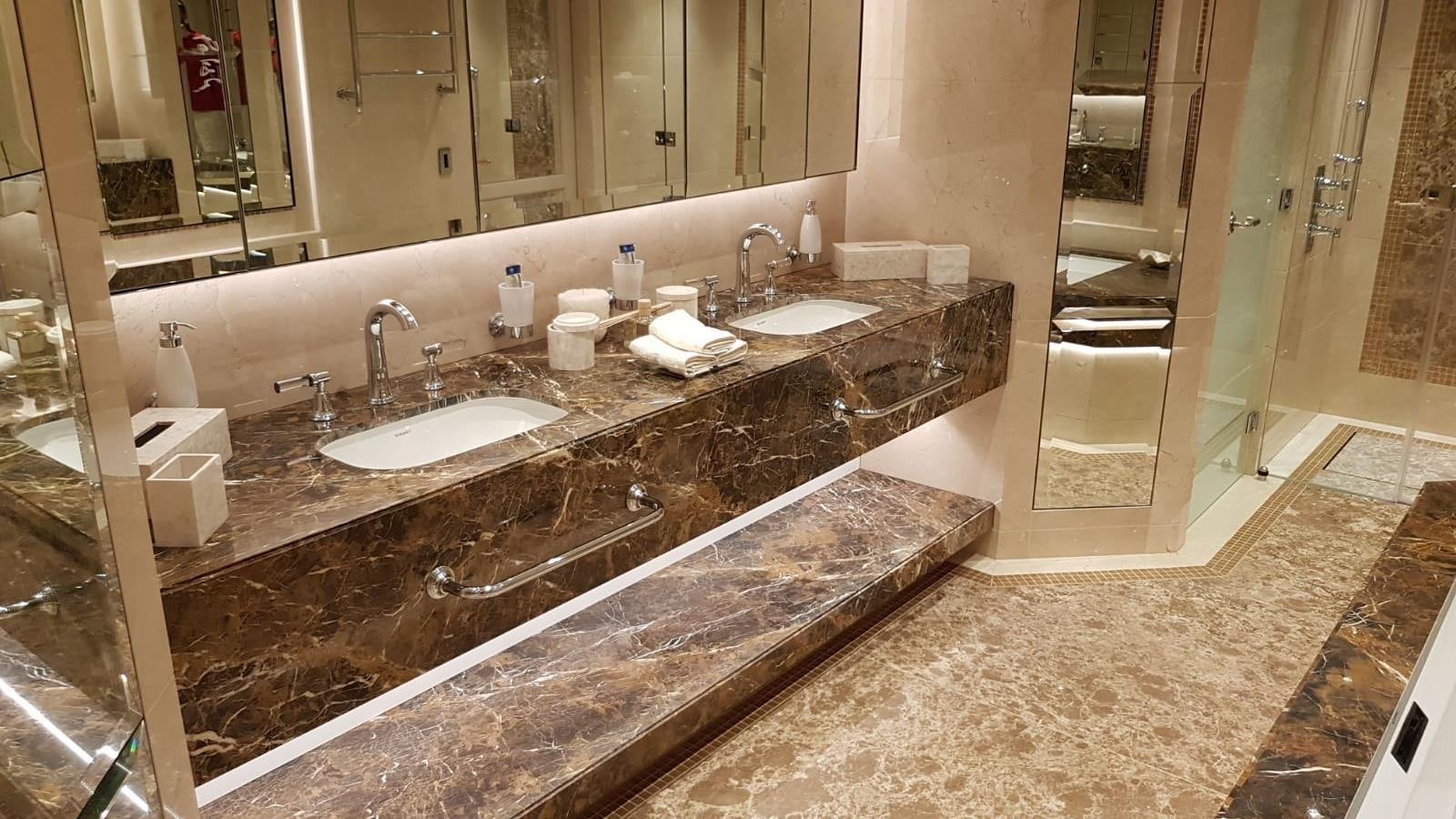 a bathroom with a countertop sink and a large mirror aboard TACANUYA Yacht for Charter