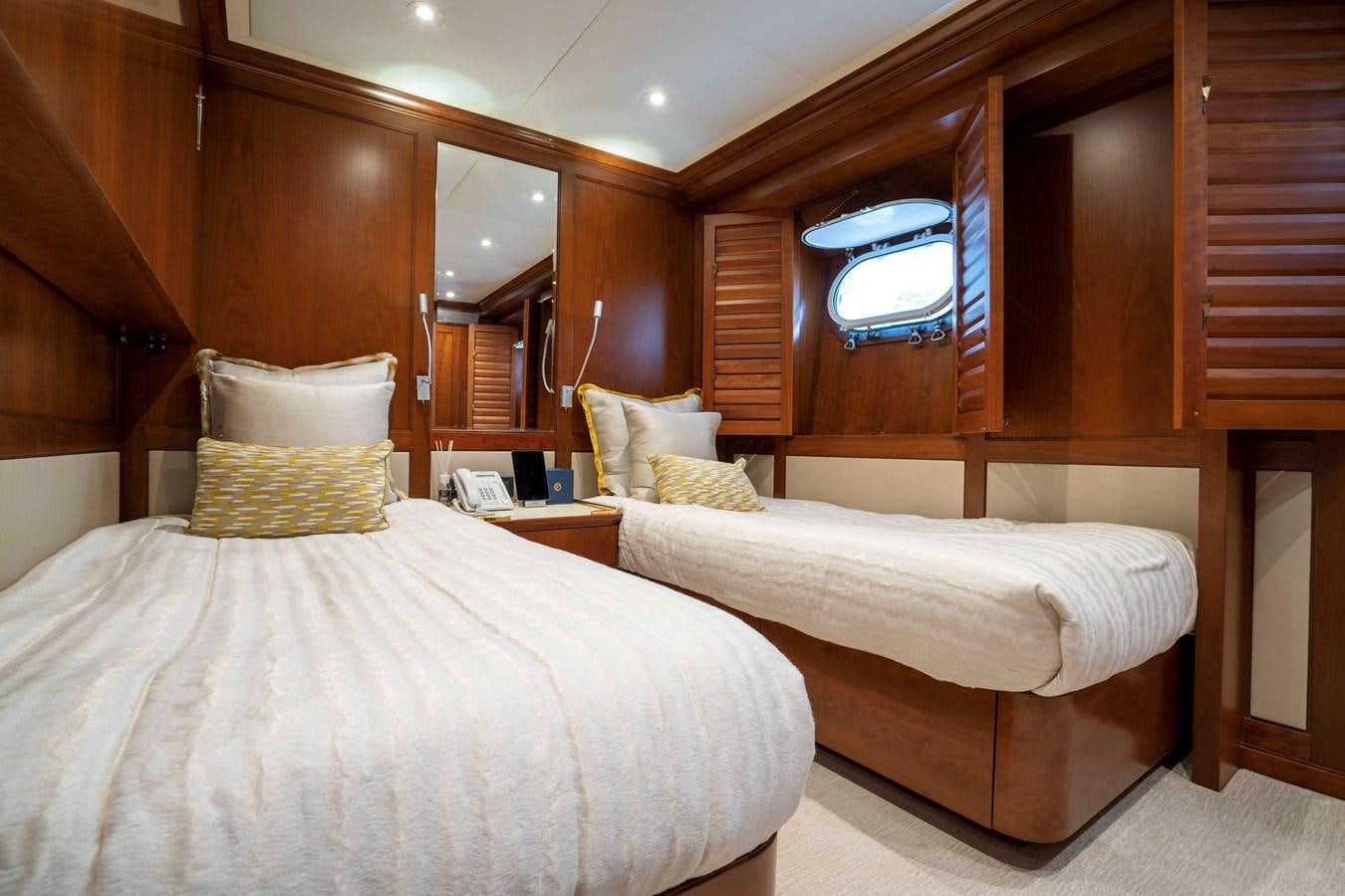 a couple of beds in a room aboard TACANUYA Yacht for Sale