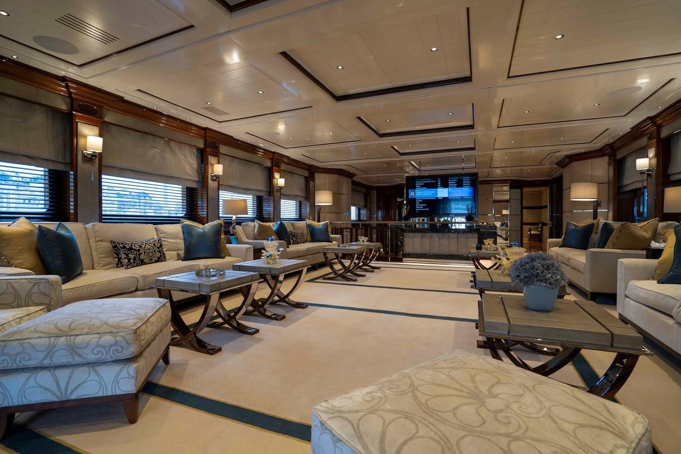 a living room with a large window aboard TACANUYA Yacht for Sale
