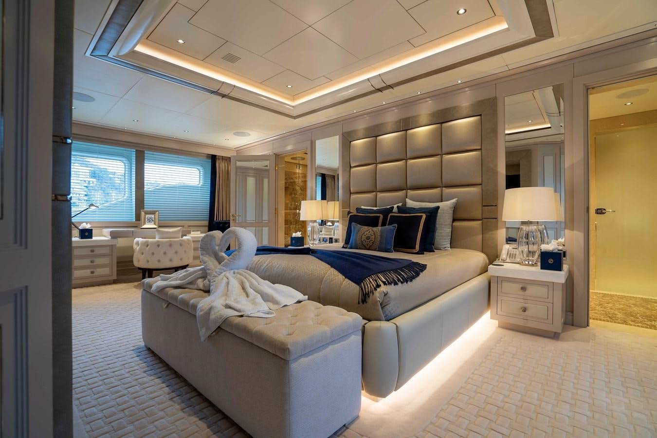 a large bedroom with a large bed aboard TACANUYA Yacht for Sale