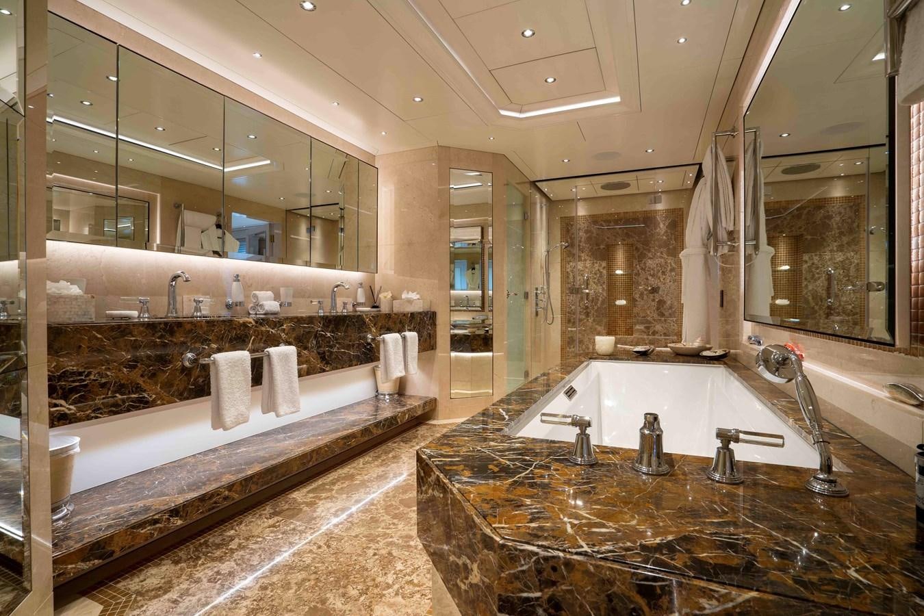 a bathroom with a large marble countertop aboard TACANUYA Yacht for Charter