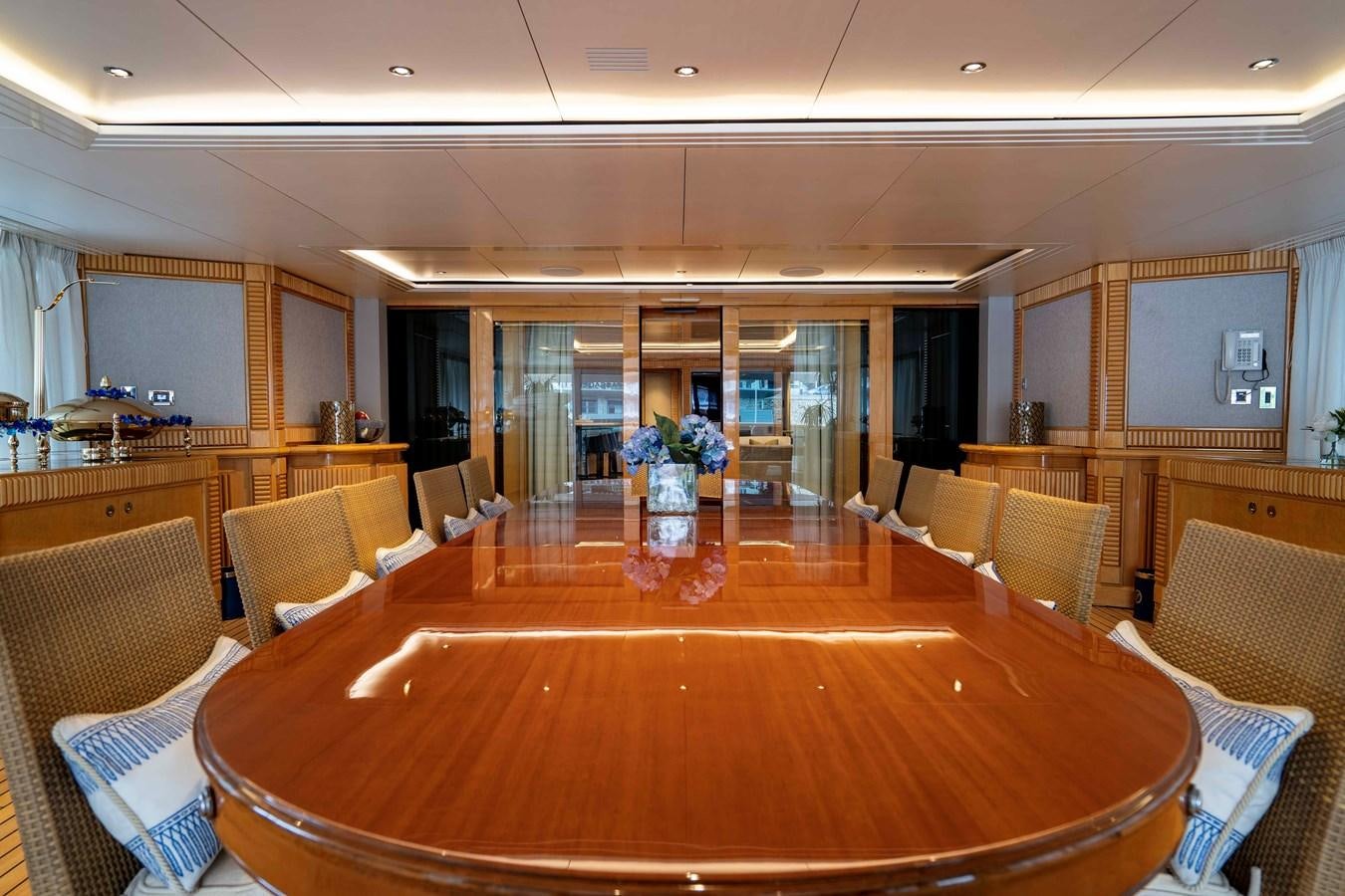 a large room with chairs and a table aboard TACANUYA Yacht for Charter