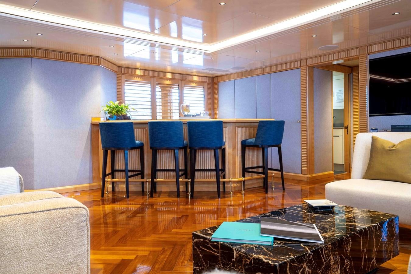 a room with a table and chairs aboard TACANUYA Yacht for Charter