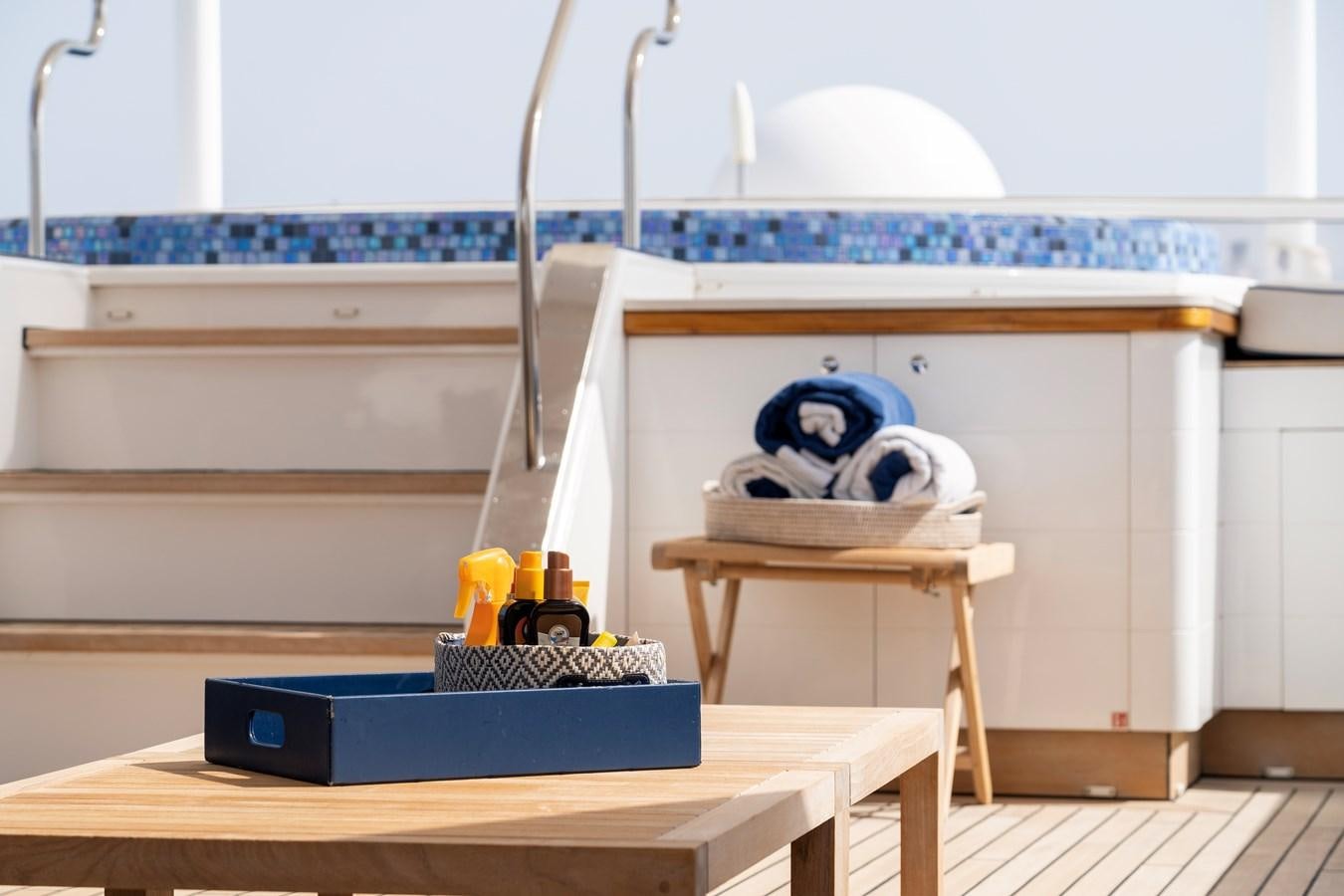 a toy monkey on a table aboard TACANUYA Yacht for Charter