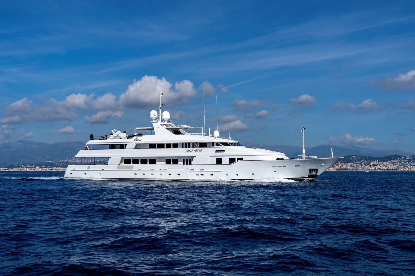 a white yacht in the water aboard TACANUYA Yacht for Charter
