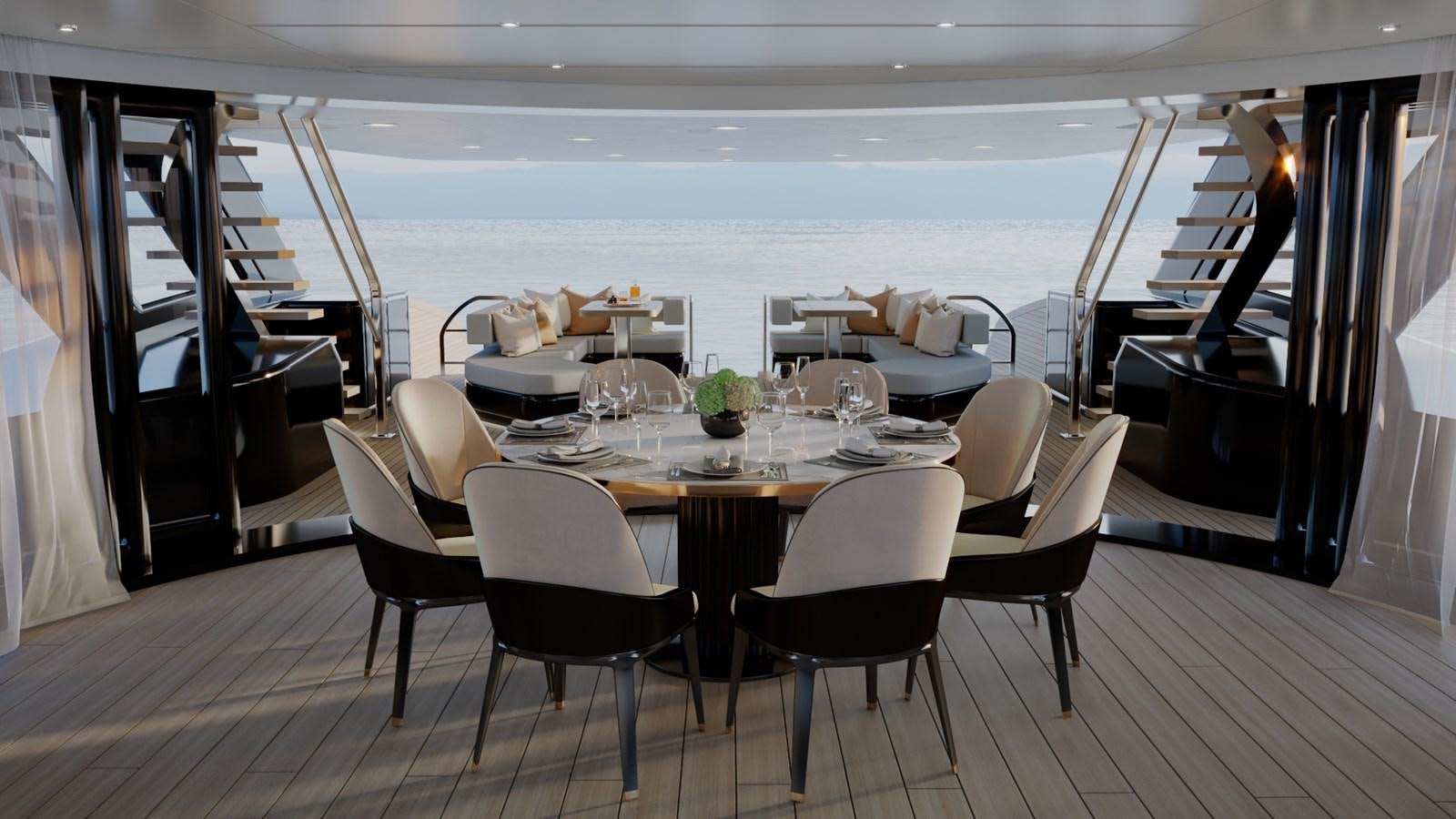 a dining table with chairs and a view of the ocean aboard PROJECT ATALAY Yacht for Sale