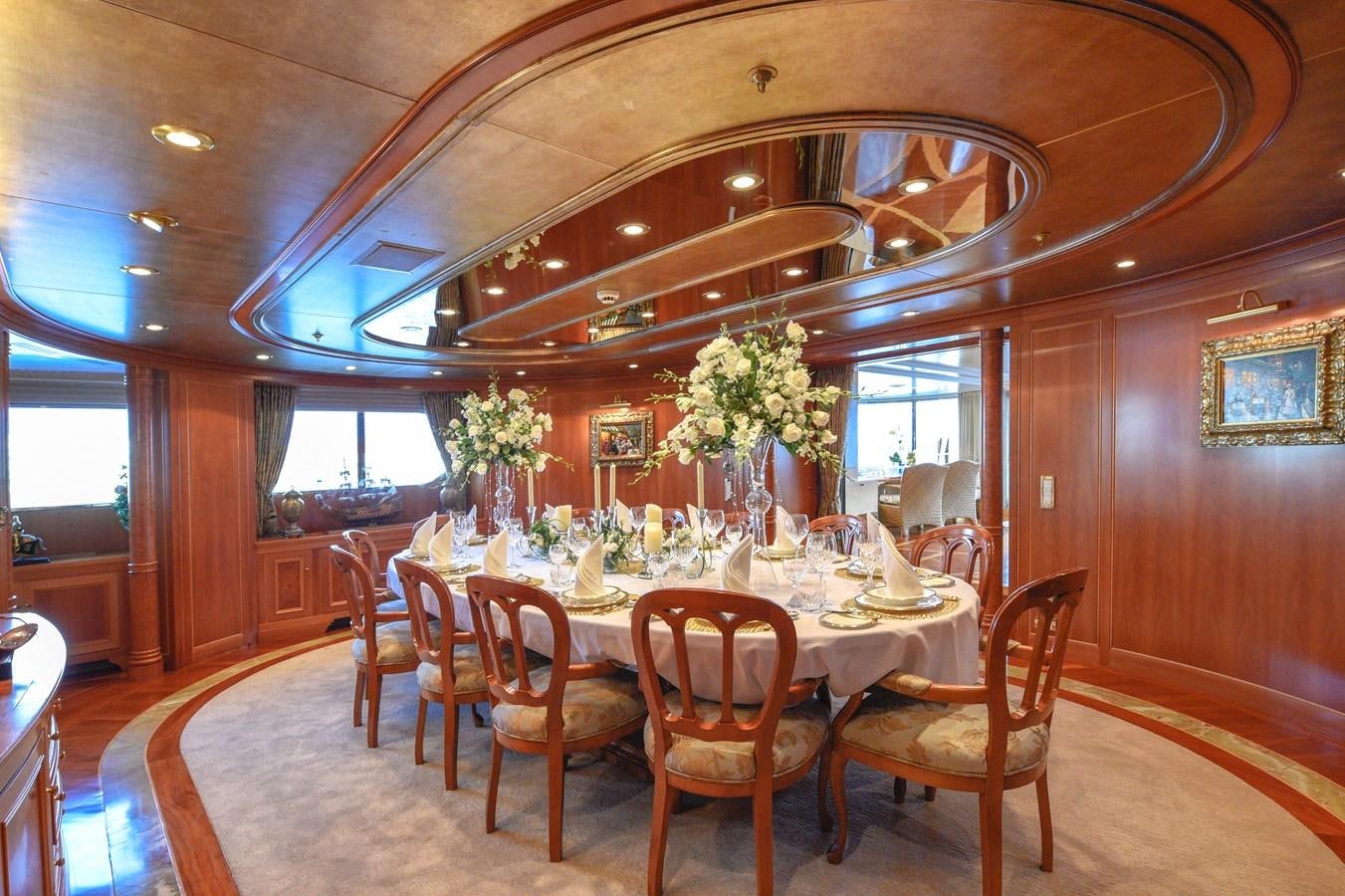 a dining room with a table and chairs aboard TE MANU Yacht for Charter