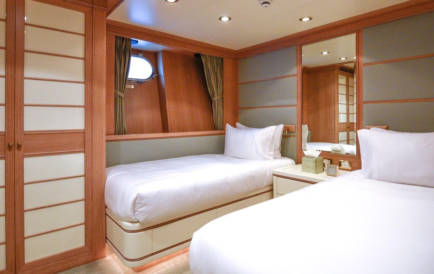 a room with two beds aboard TE MANU Yacht for Charter