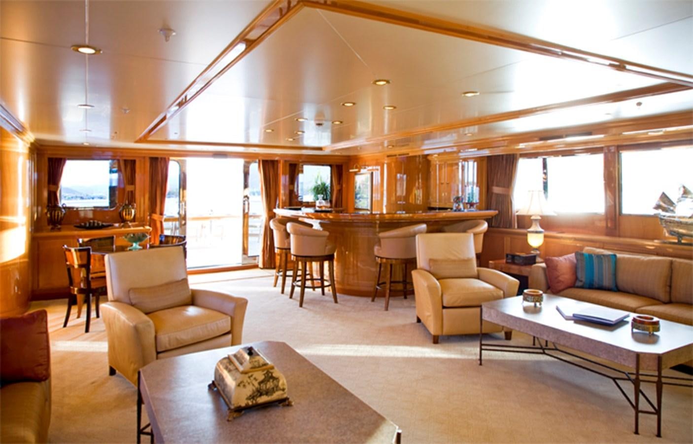 a living room with a table and chairs aboard TE MANU Yacht for Charter