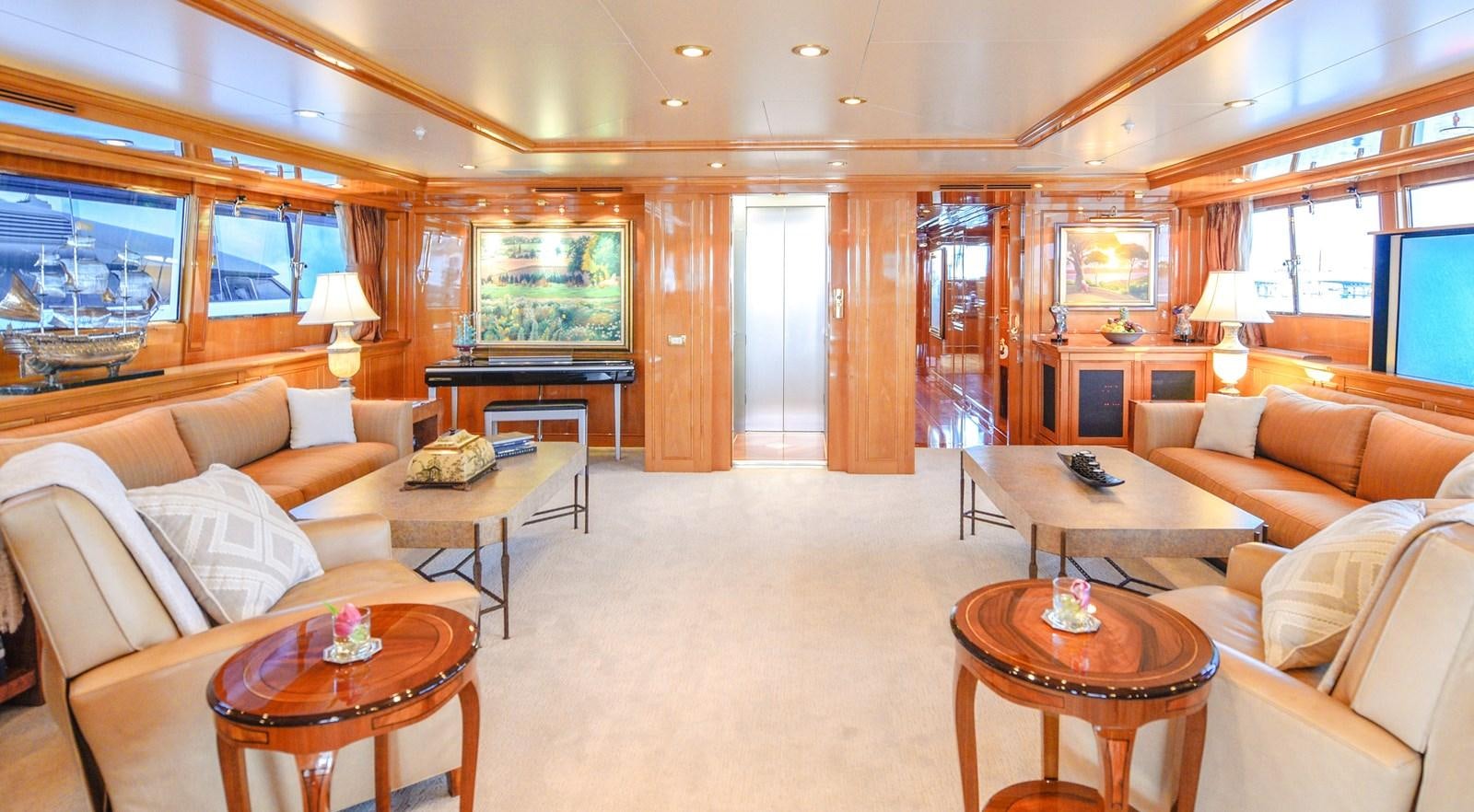 a living room with a couch and a table aboard TE MANU Yacht for Charter