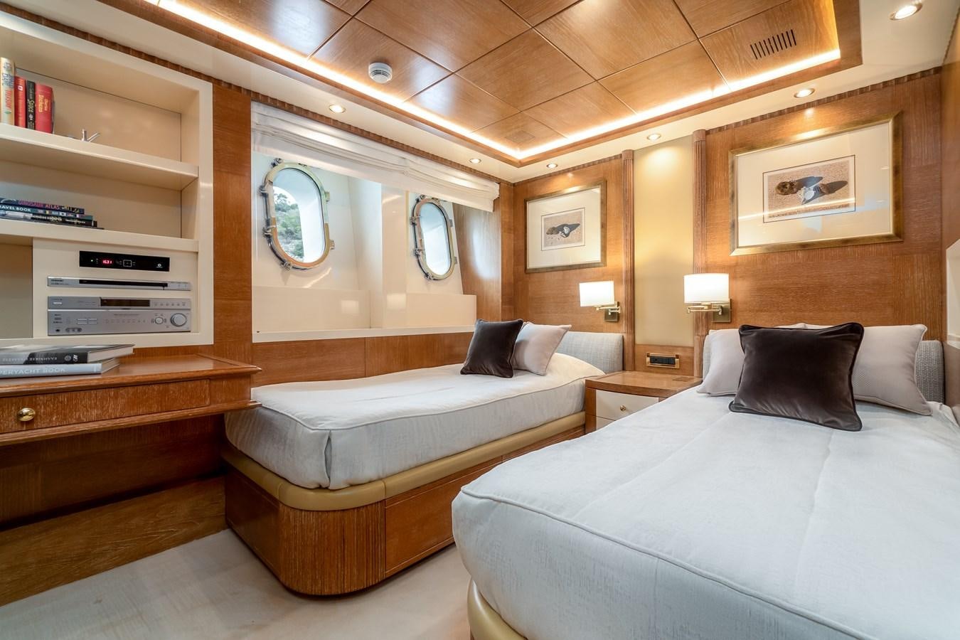 a room with two beds aboard OCEANOS Yacht for Sale