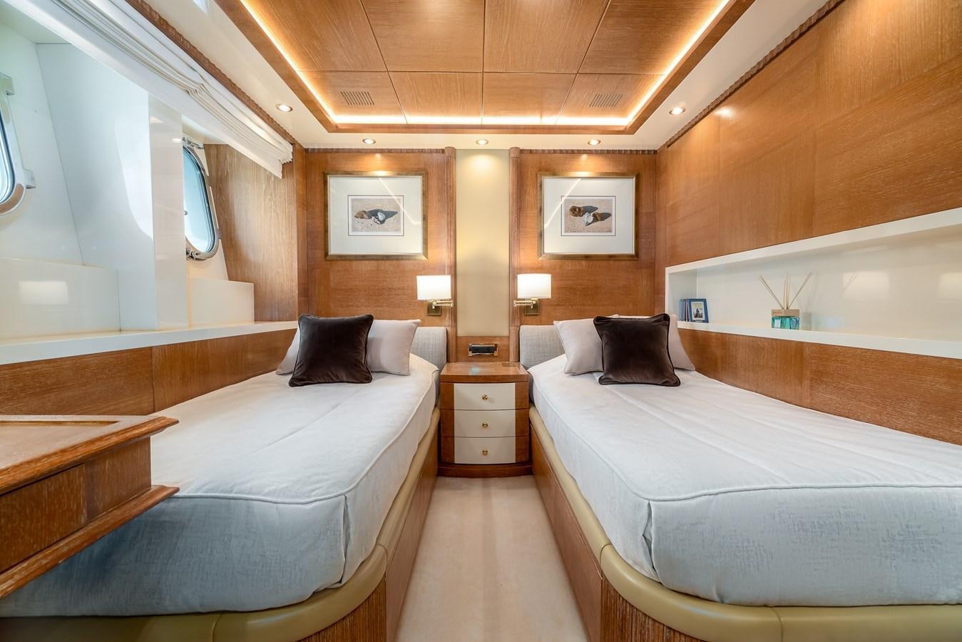 a room with two beds aboard OCEANOS Yacht for Sale