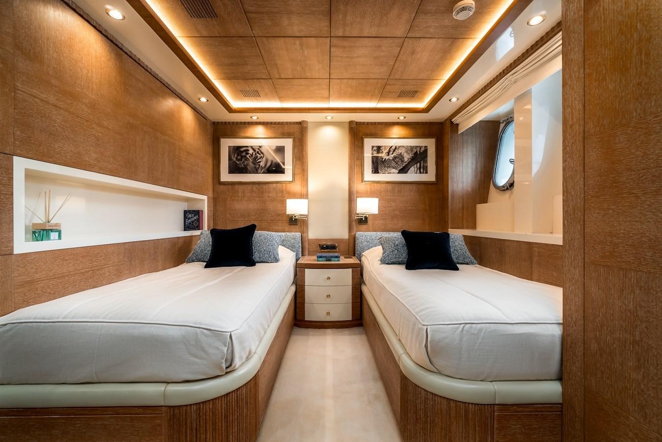 a room with two beds aboard OCEANOS Yacht for Sale