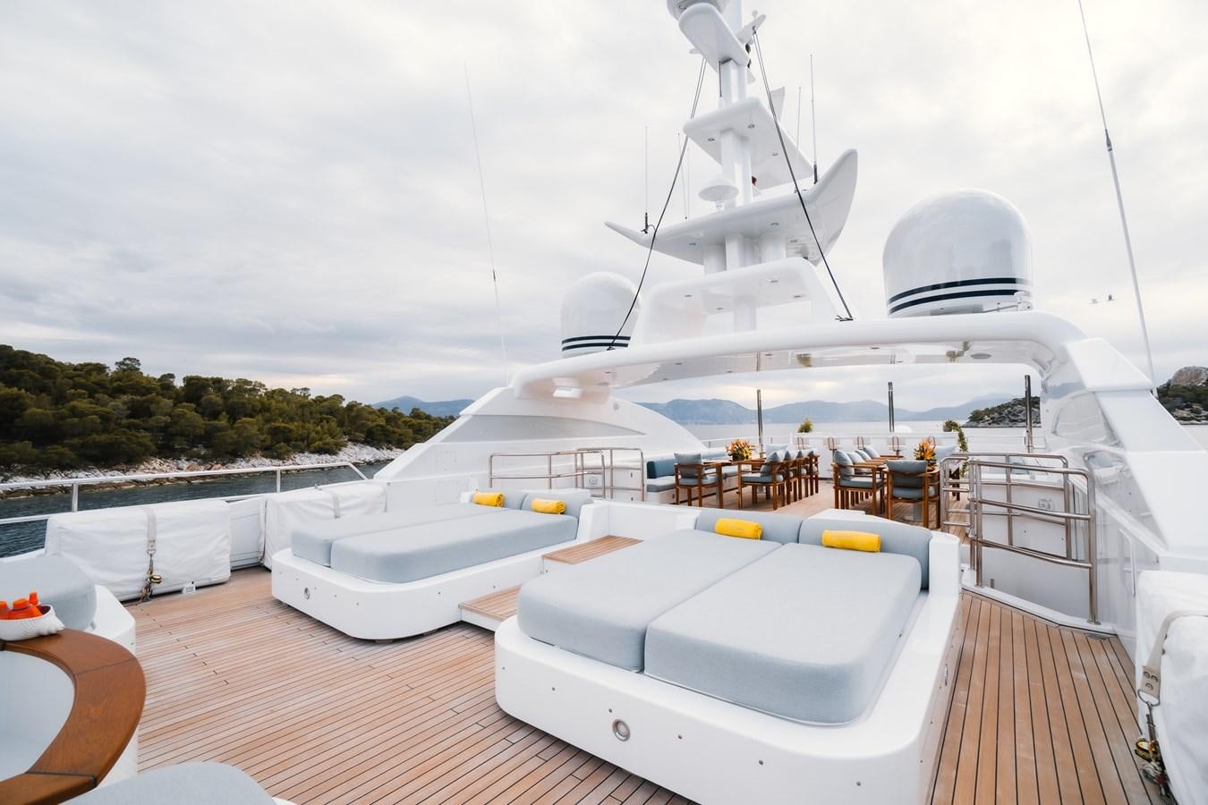 a large white boat on a deck aboard OCEANOS Yacht for Sale