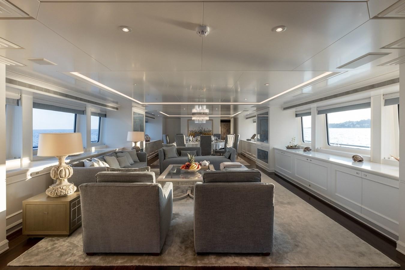a living room with a large window aboard IDEFIX II Yacht for Sale