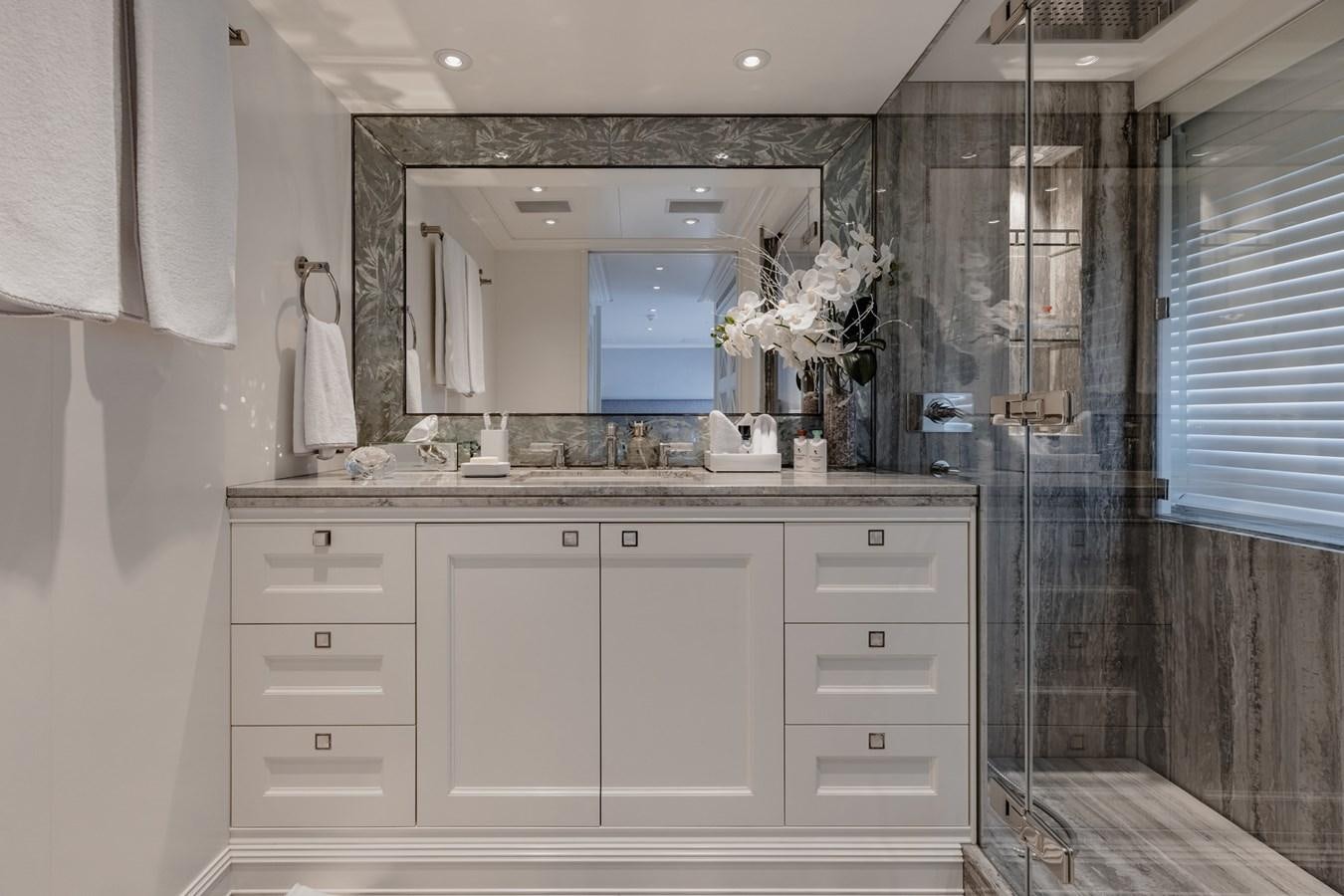 a bathroom with a sink and a mirror aboard IDEFIX II Yacht for Charter