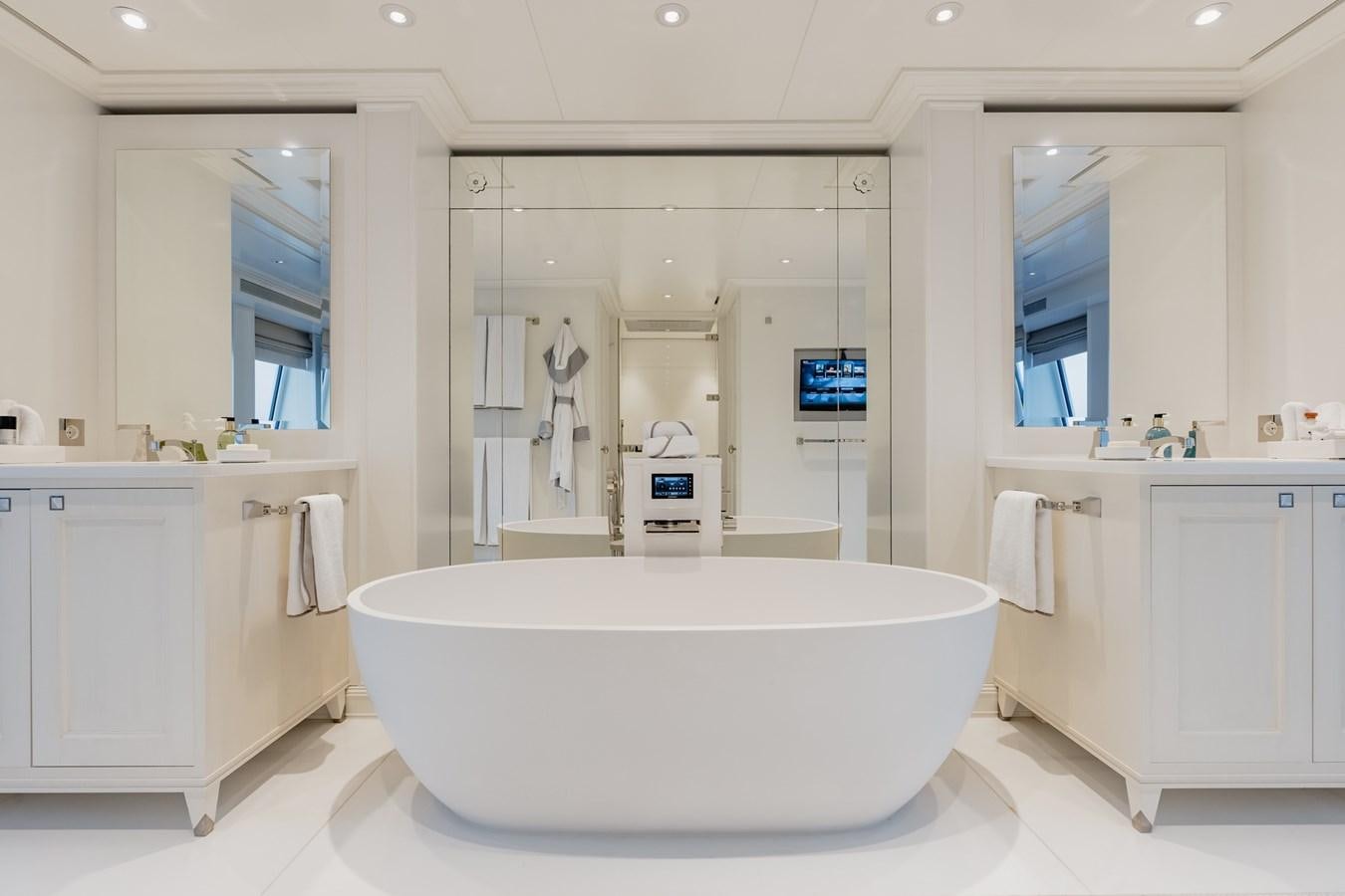 a large white bathroom aboard IDEFIX II Yacht for Sale