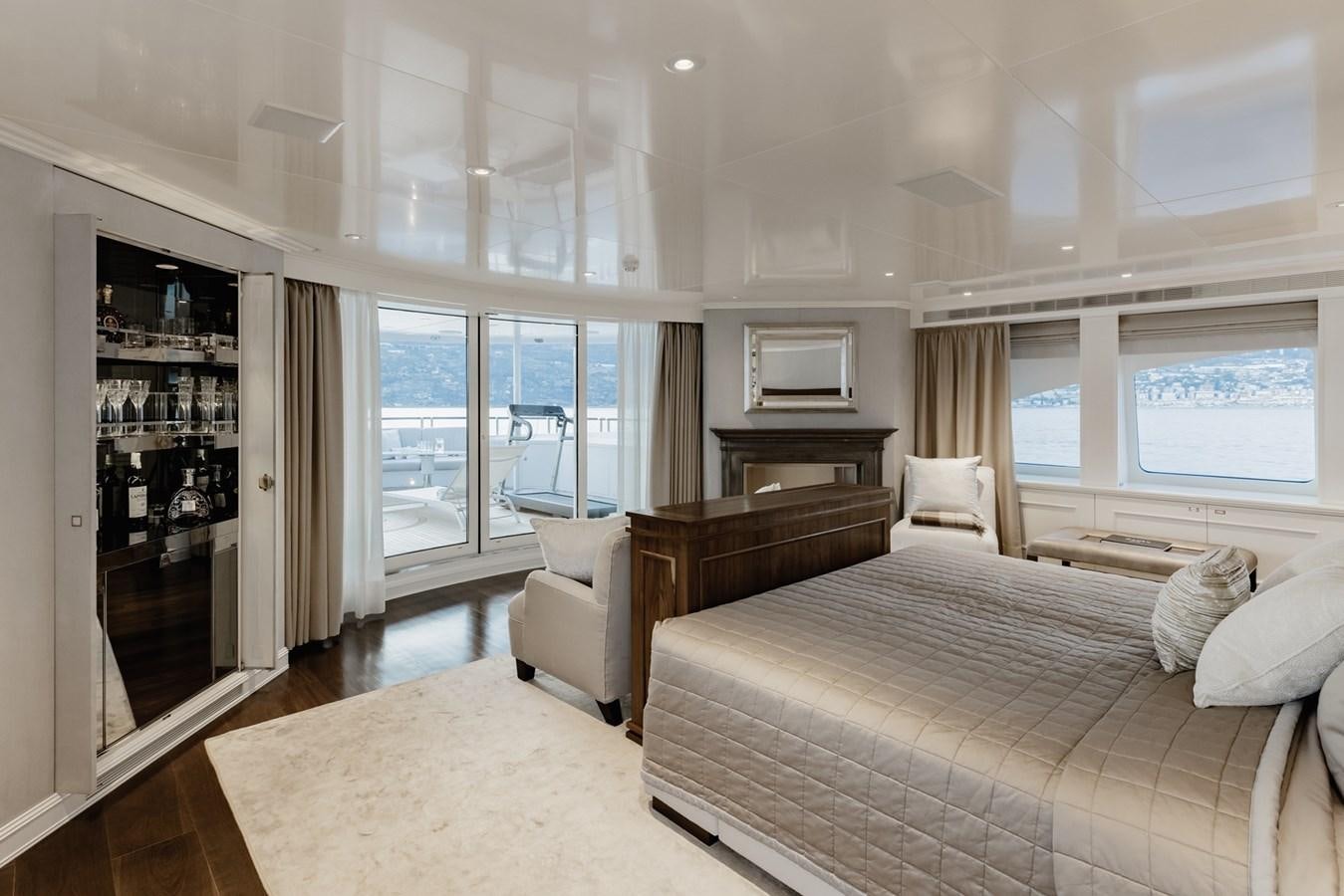 a bedroom with a bed and a tv aboard IDEFIX II Yacht for Charter