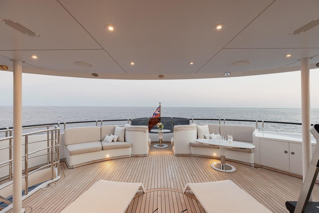 a large living room with a large balcony overlooking the ocean aboard IDEFIX II Yacht for Charter