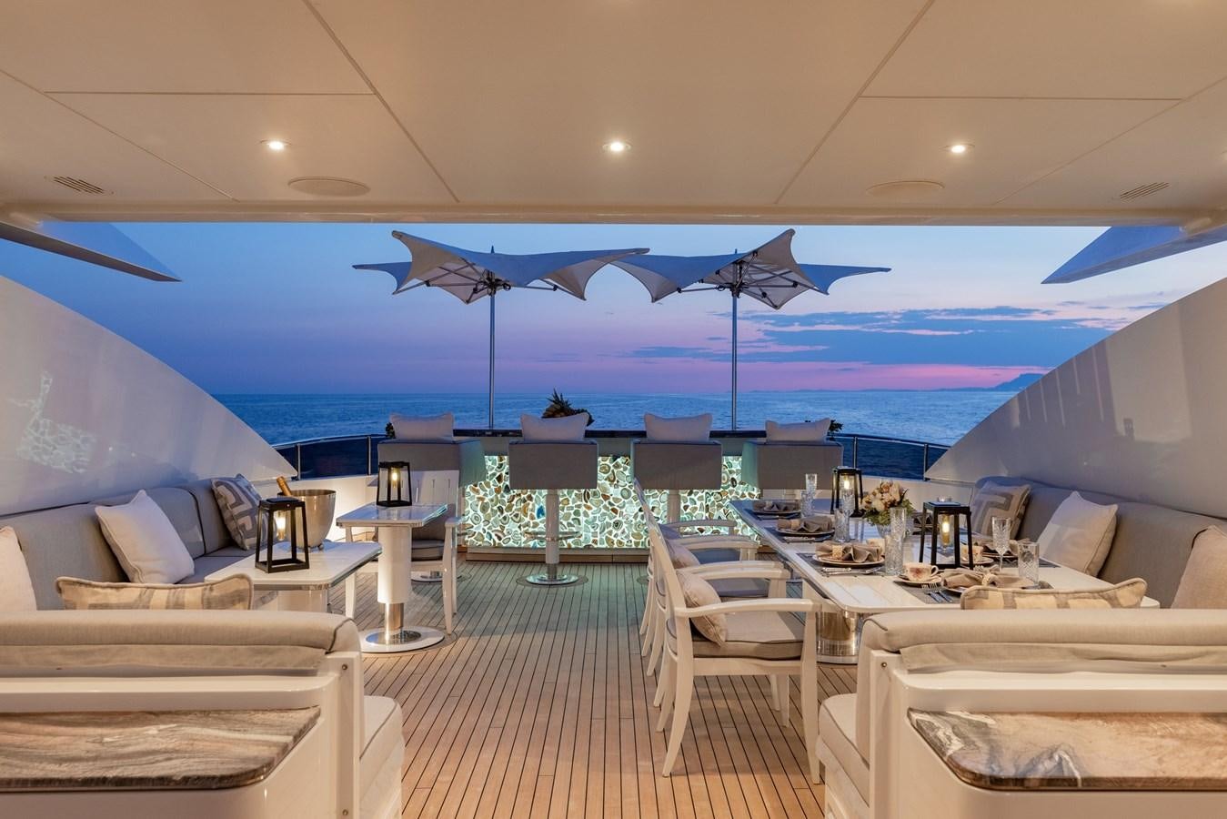 a room with a view of the ocean and the pool aboard IDEFIX II Yacht for Charter