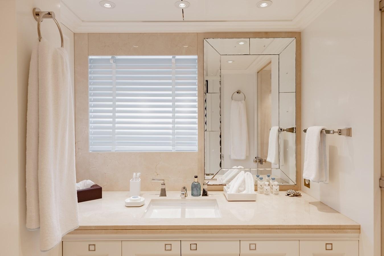 a bathroom with a mirror and a sink aboard IDEFIX II Yacht for Charter