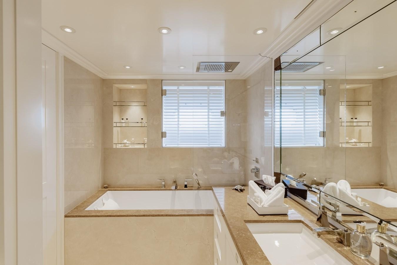 a bathroom with a large mirror aboard IDEFIX II Yacht for Charter