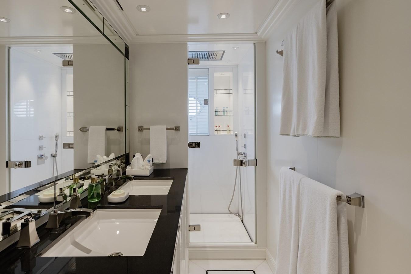 a bathroom with a sink and a mirror aboard IDEFIX II Yacht for Charter