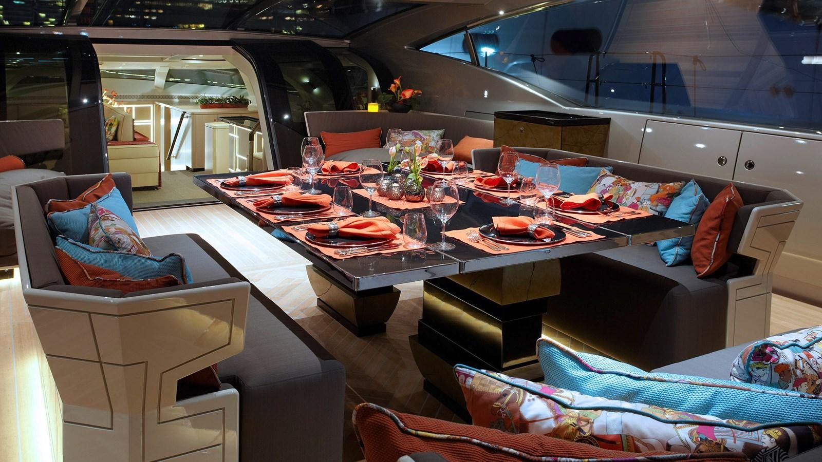 a table with plates and food on it aboard SAGITTA Yacht for Sale