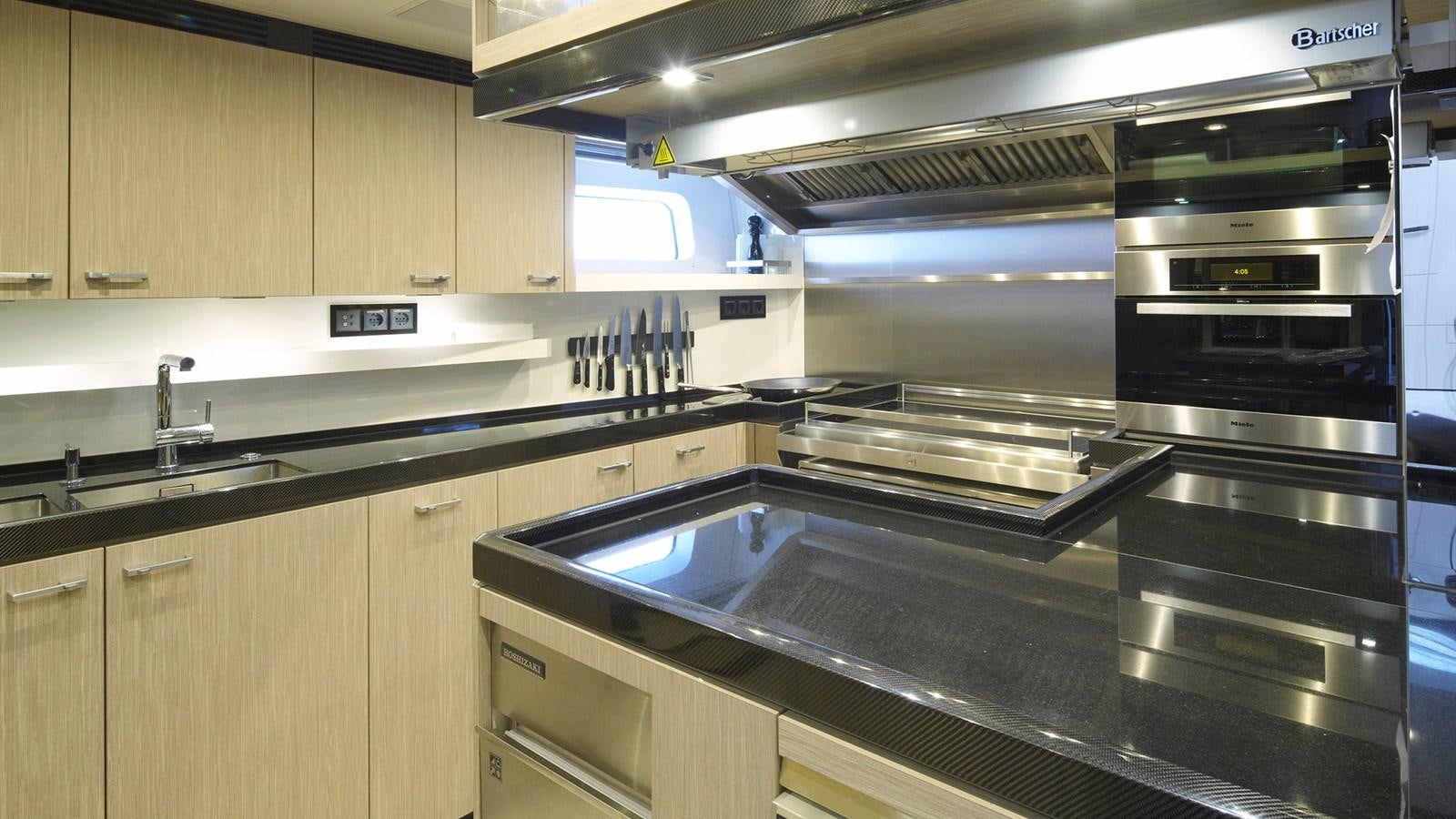 a kitchen with stainless steel appliances aboard SAGITTA Yacht for Sale