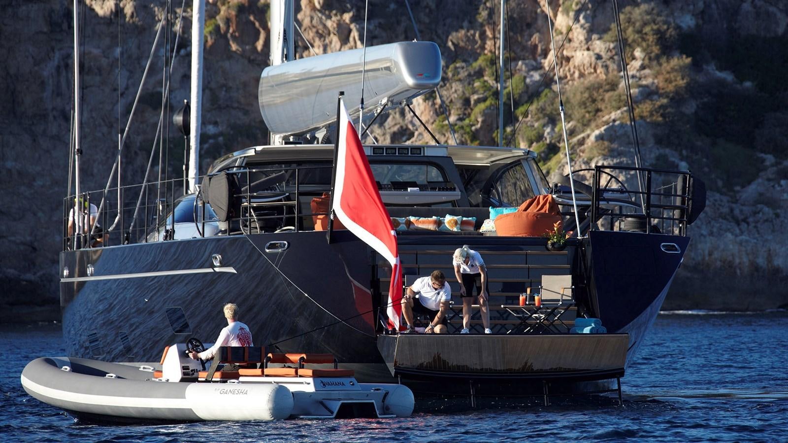 a boat with a flag on it aboard SAGITTA Yacht for Sale