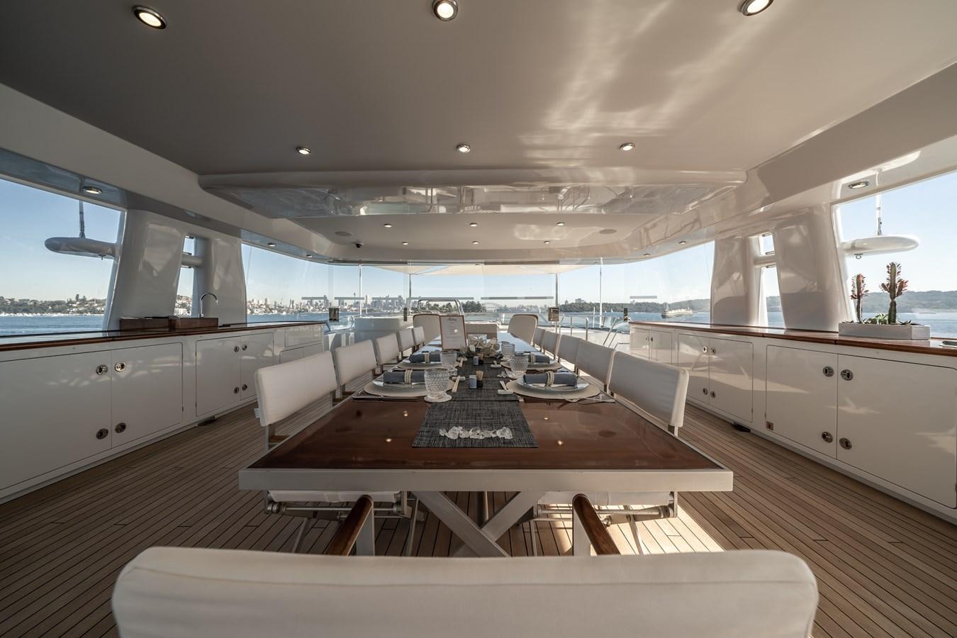 a large room with a table and chairs aboard MOATIZE Yacht for Sale