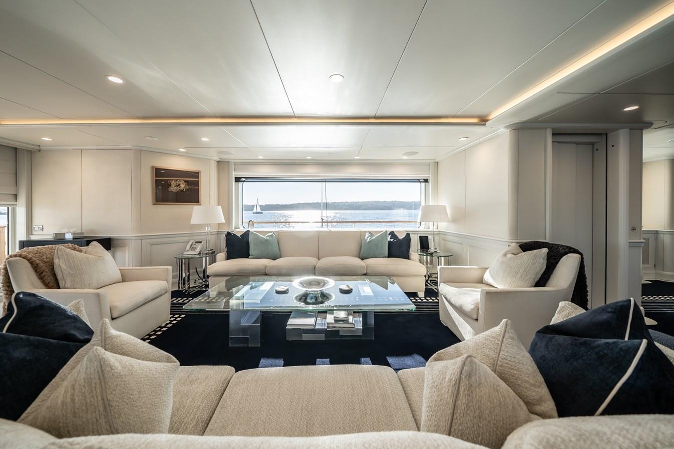 a living room with a large window aboard MOATIZE Yacht for Sale