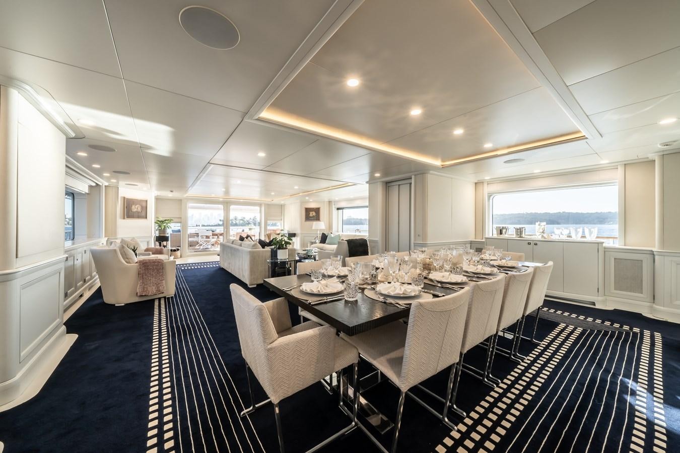 a large room with tables and chairs aboard MOATIZE Yacht for Sale