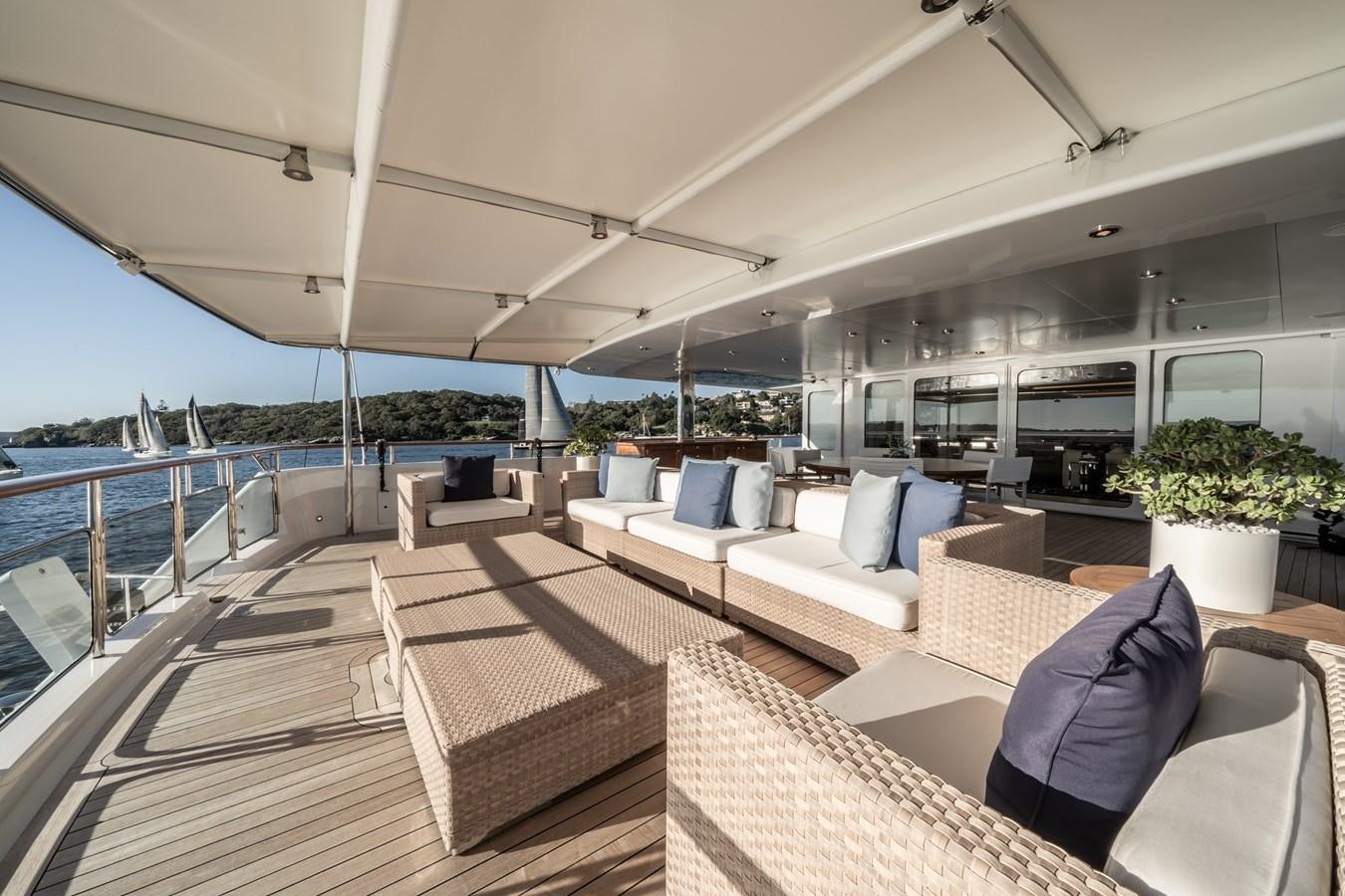 a large living room with a large deck and a large pool aboard MOATIZE Yacht for Sale