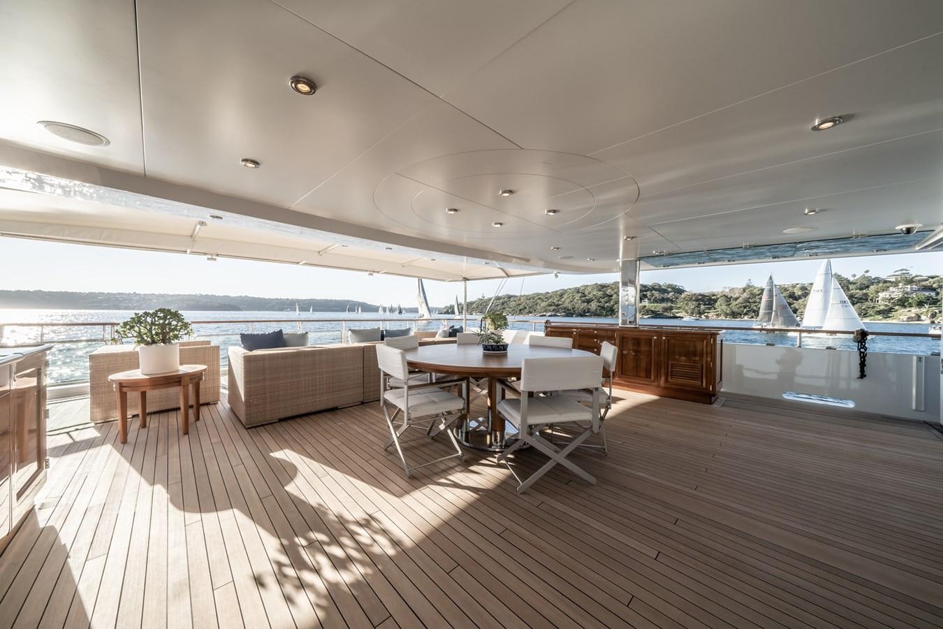 a room with a table and chairs aboard MOATIZE Yacht for Sale
