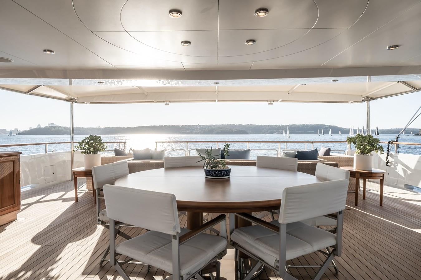 a room with a table and chairs aboard MOATIZE Yacht for Sale