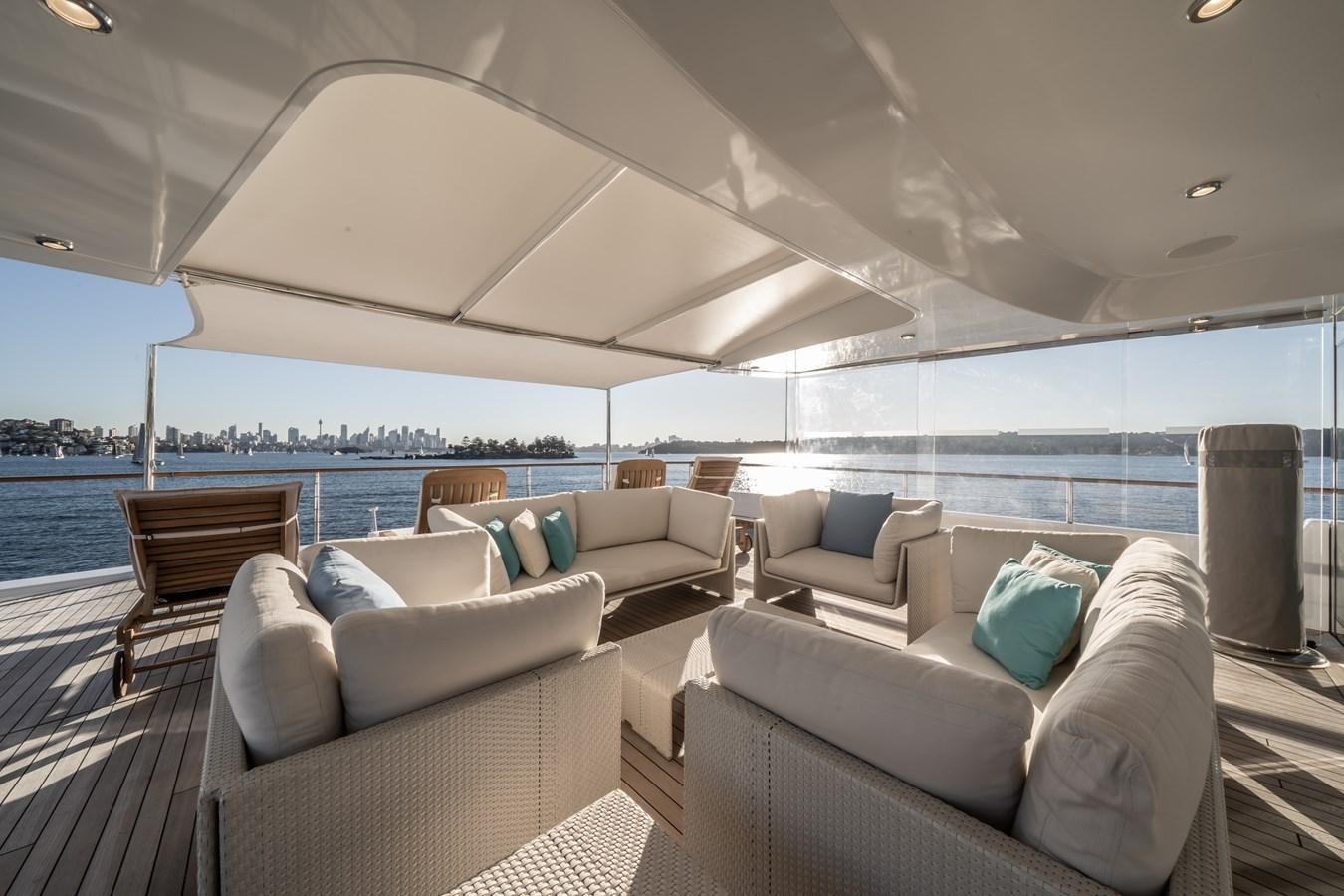 a room with couches and a large window aboard MOATIZE Yacht for Sale