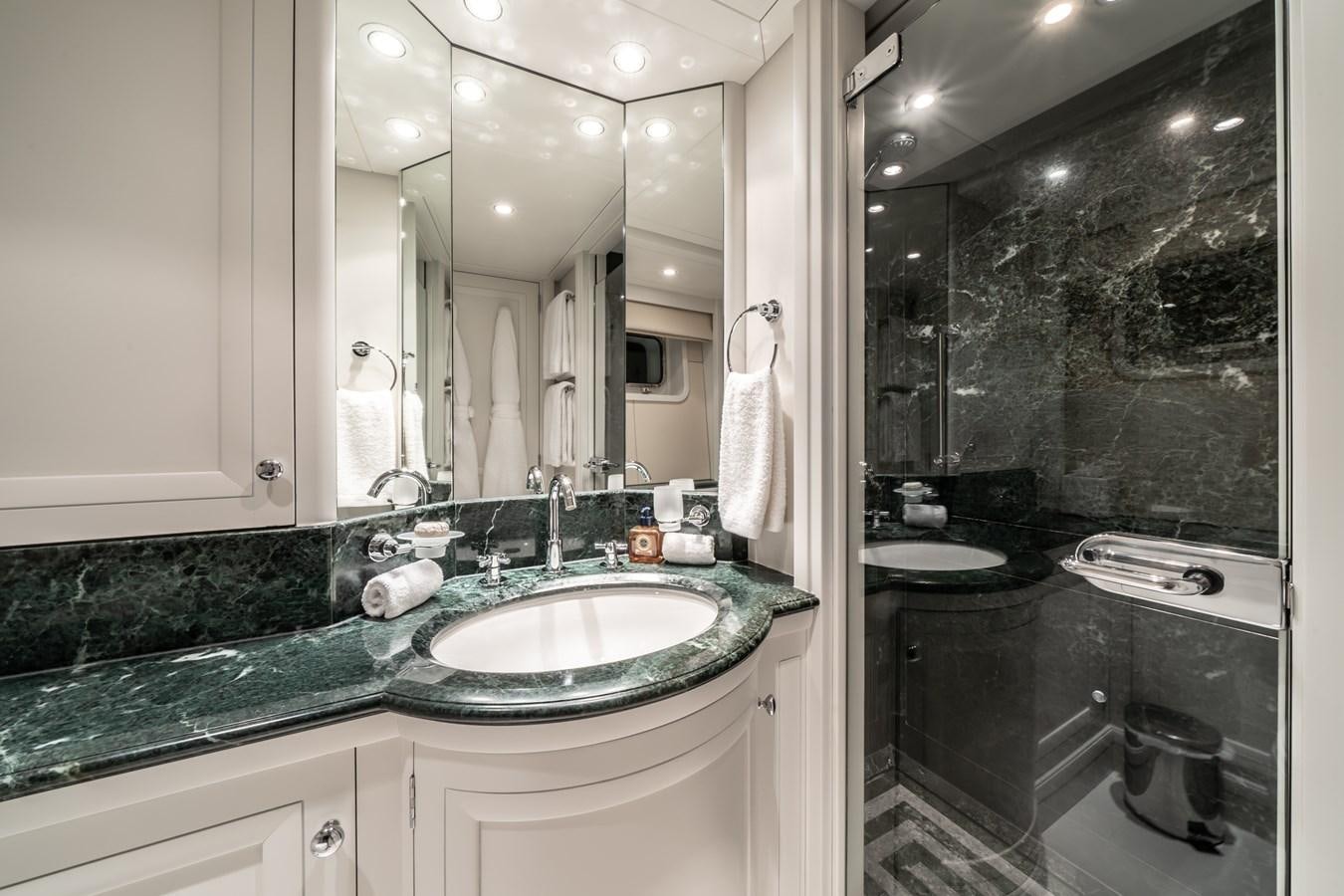 a bathroom with a large mirror aboard MOATIZE Yacht for Sale