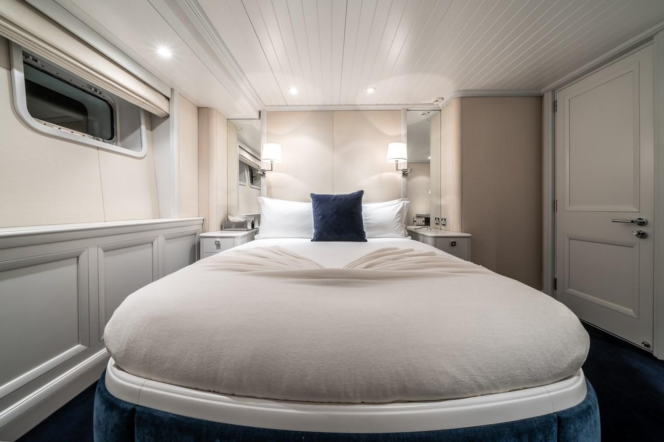 a bed with white sheets aboard MOATIZE Yacht for Sale