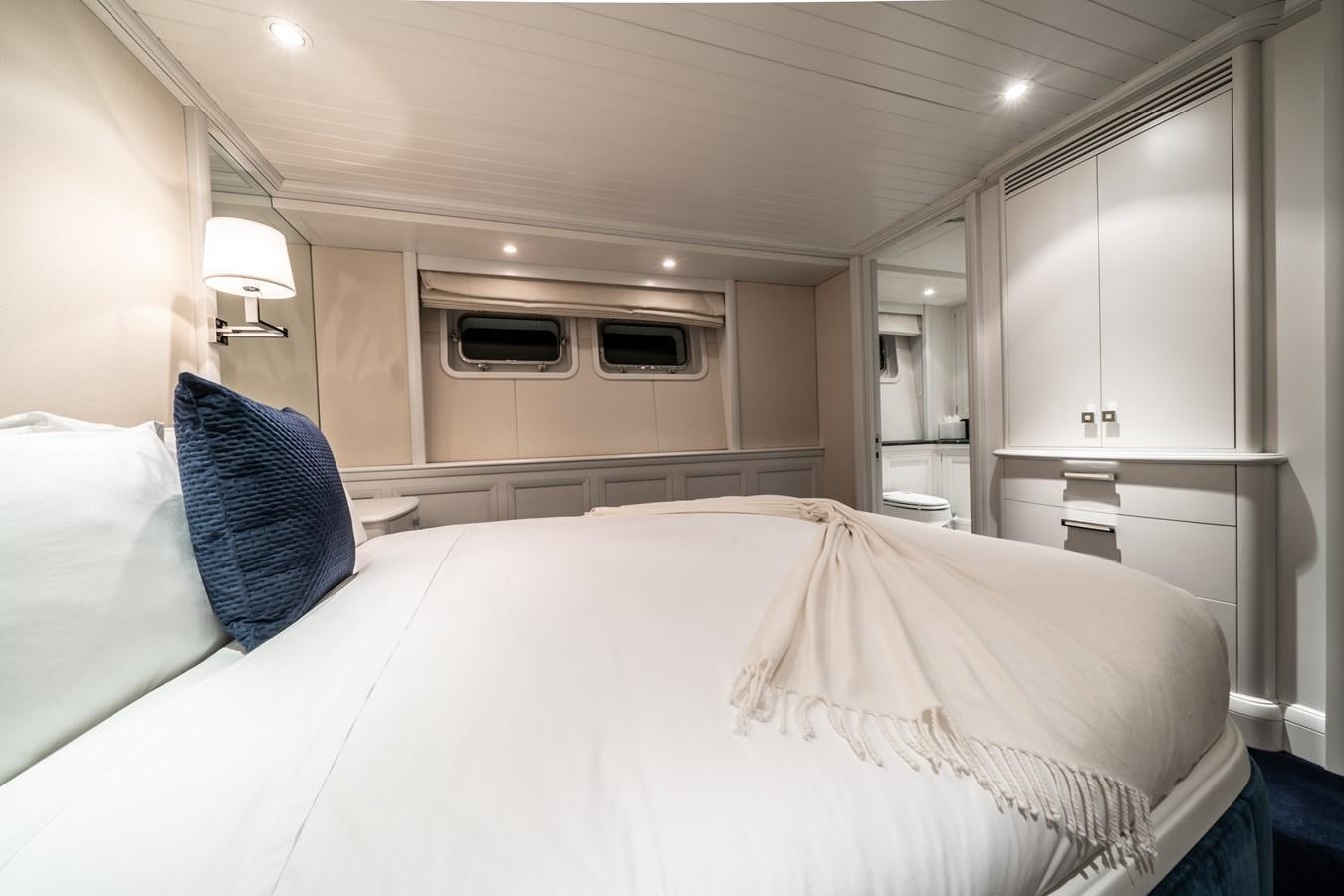 a bed with a white sheet aboard MOATIZE Yacht for Sale